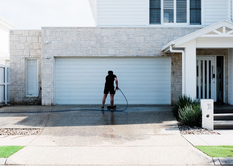 CoatPro pressure cleaning a driveway before sealing