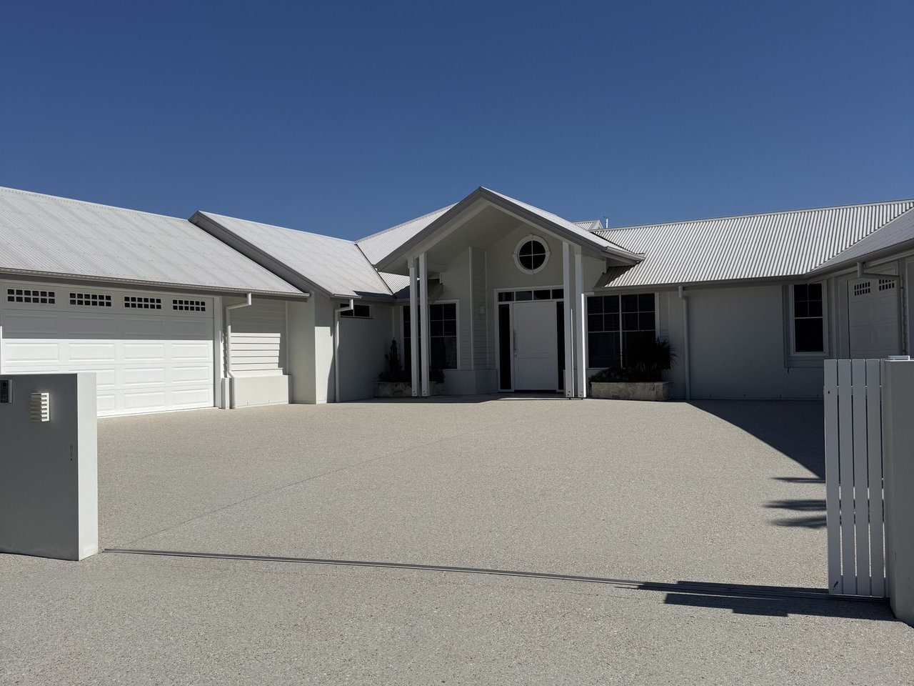 Sealed exposed-aggregate driveway in full sun at a coastal-style home in Cleveland, Brisbane