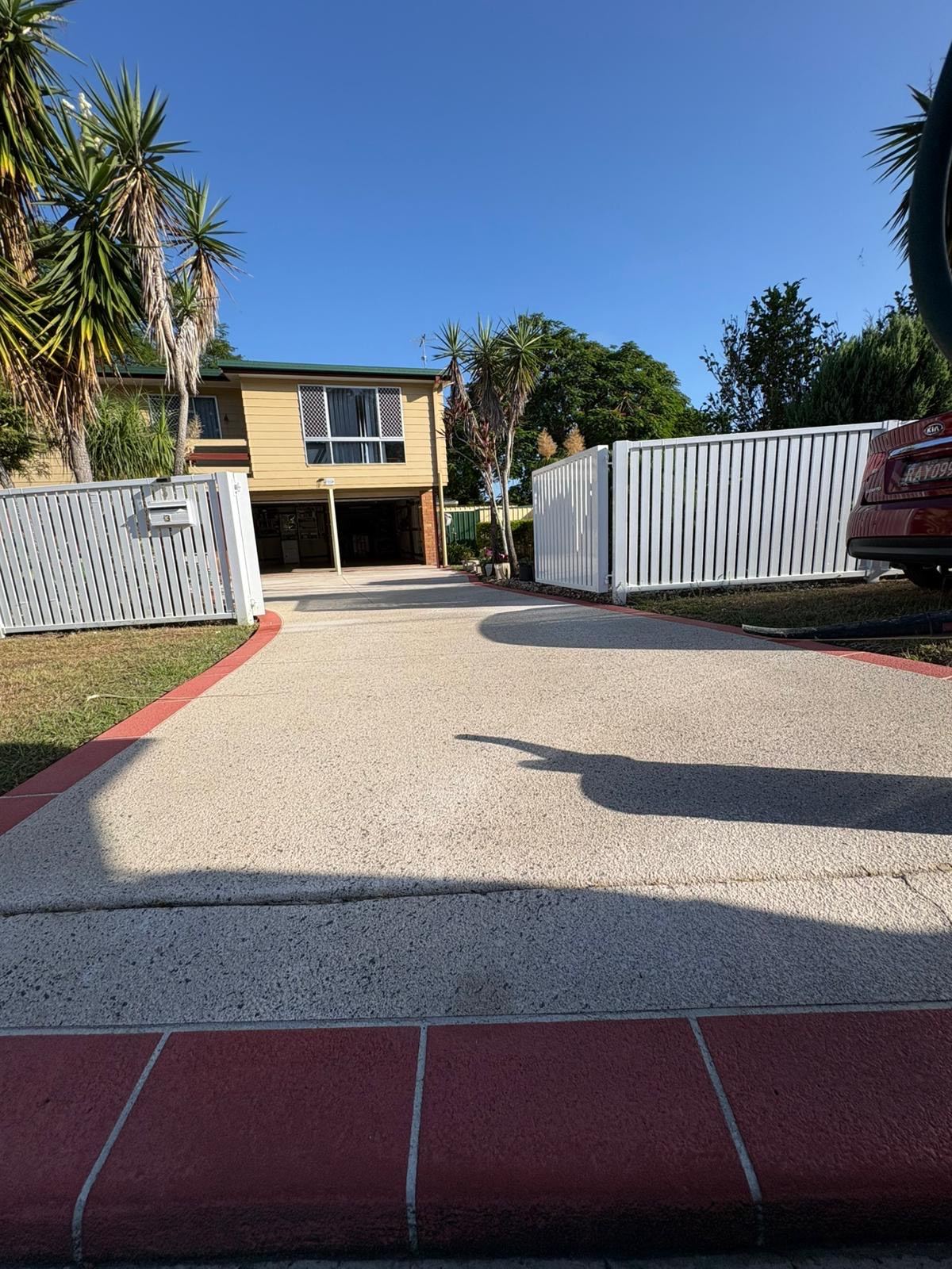Before: Faded driveway with a border